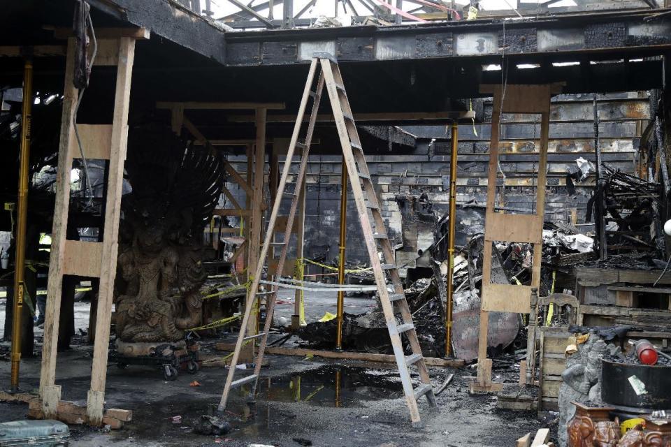 A ladder stands inside the charred warehouse Tuesday, Dec. 13, 2016, in Oakland, Calif. The fire, which happened on Friday, Dec 2, killed dozens of people during a electronic dance party as it raced through the building, in the deadliest structure fire in the U.S. in more than a decade. (AP Photo/Marcio Jose Sanchez)