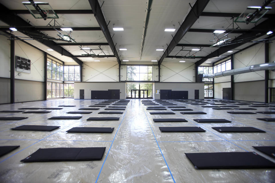 Beds are laid out in a cooling center at the Charles Jordan Community Center in Portland, Ore., Tuesday, July 26, 2022. Temperatures are expected to top 100 degrees F (37.8 C) on Tuesday and wide swaths of western Oregon and Washington are predicted to be well above historic averages throughout the week. (AP Photo/Craig Mitchelldyer)