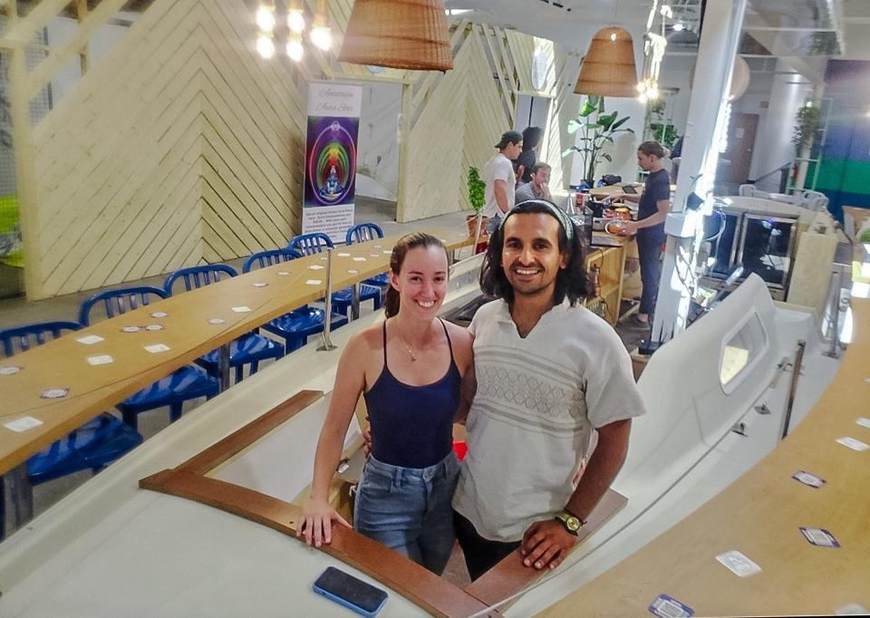 Willa Darian and Hamid Pezeshkian are shown in a sailboat converted into a bar in the middle of their new retail and event center, Sailor and Dock.