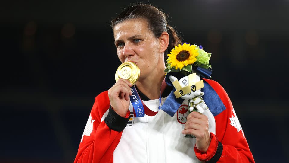 Sinclair poses with her gold medal at the Tokyo 2020 Olympic Games. - Naomi Baker/Getty Images