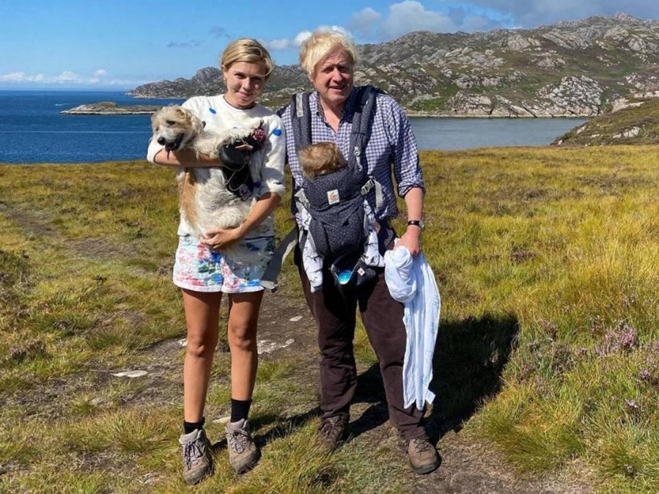 Boris and Carrie Johnson posing with dog Dilyn and son Wilfred in the Scottish Highlands (Carrie Symonds/Instagram)