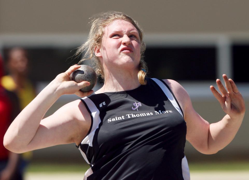 St. Thomas More senior Christina Hillman throws the shot put during the finals of the state track and field meet in 2011.