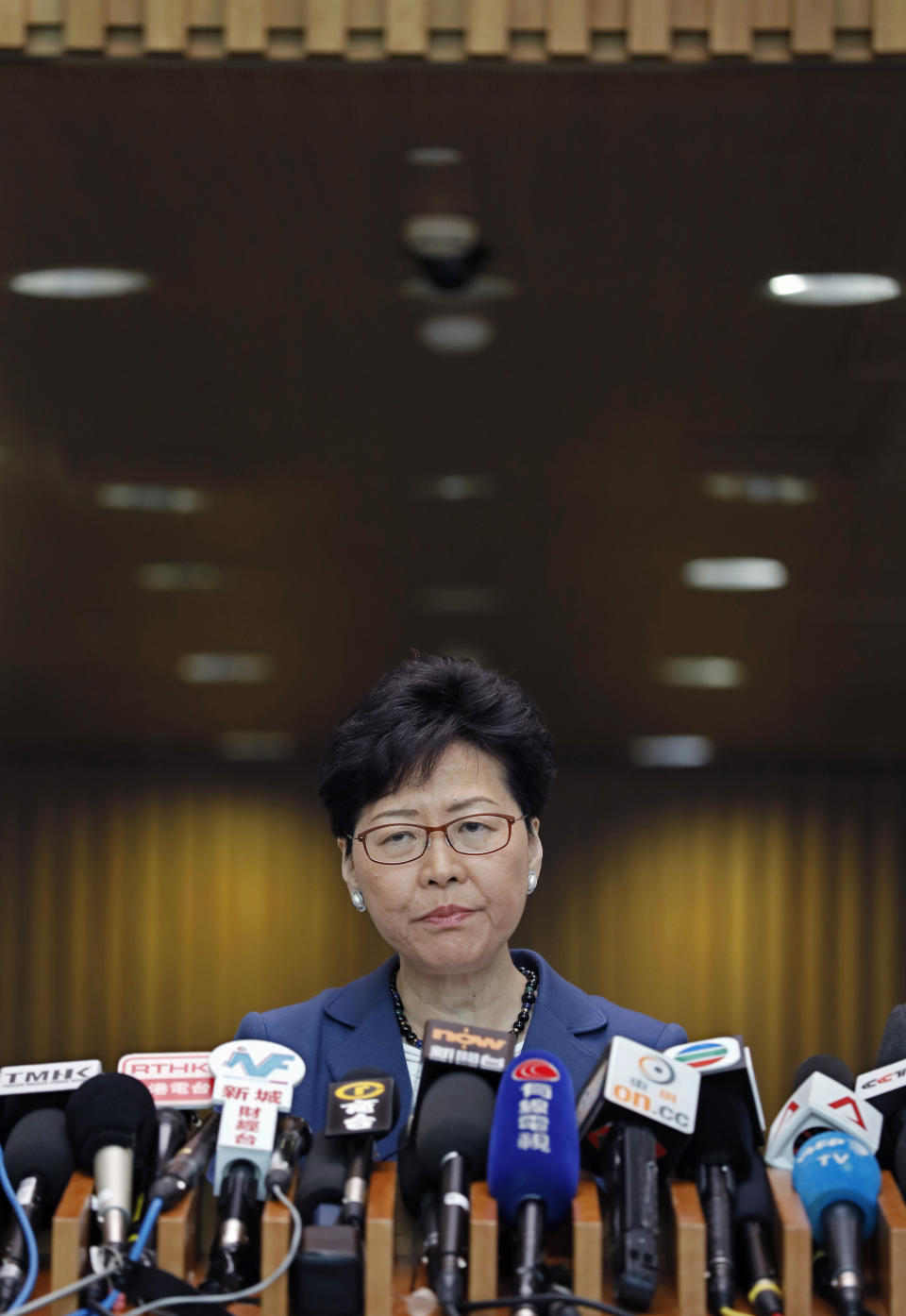 Hong Kong Chief Executive Carrie Lam listens to reporters questions during a press conference in Hong Kong Monday, June 10, 2019. Lam signaled Monday that her government will go ahead with proposed amendments to its extradition laws after a massive protest against them. (AP Photo/Vincent Yu)