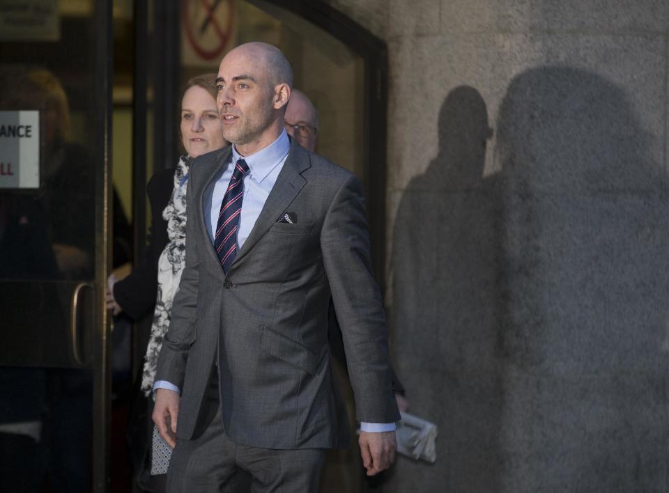 Former tabloid journalist Dan Evans leaves The Old Bailey law court in London, Monday, Jan. 27, 2014. Evans told Britain's phone hacking trial on Monday that he intercepted voicemails with the knowledge of senior staff _ not just at the now-defunct News of the World, whose employees are standing trial, but at the rival Sunday Mirror. Dan Evans has pleaded guilty to phone hacking while working at both newspapers between 2003 and 2010. He gave evidence as a prosecution witness at the trial of former News of the World editors Rebekah Brooks and Andy Coulson and five others. (AP Photo/Alastair Grant)