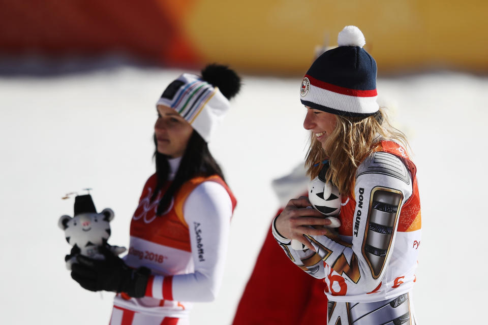 Super-G silver medalist Anna Veith, left, stands next to surprising gold medal winner Ester Ledecka. (Getty)