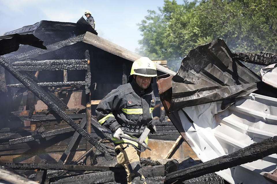 In this photo released by the Dnipro Regional Administration, rescuers work on the scene of a building damaged during Russia's missile attack in Dnipro, Ukraine, Wednesday, July 3, 2024. (Dnipro Regional Administration via AP)