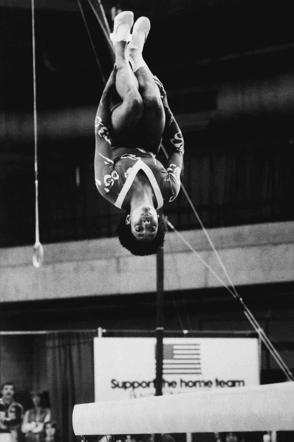 FIlE - In this June 6, 1983, file photo, Dianne Durham, of Gary, Ind., does a flip during individual final competition of the balance beam in Chicago at the McDonald's Gymnastic Championships of the U.S.A. Durham, the first Black woman to win a USA Gymnastics national championship, died on Thursday, Feb. 4, 2021, She was 52. (AP Photo/Lisa Genesen, File)