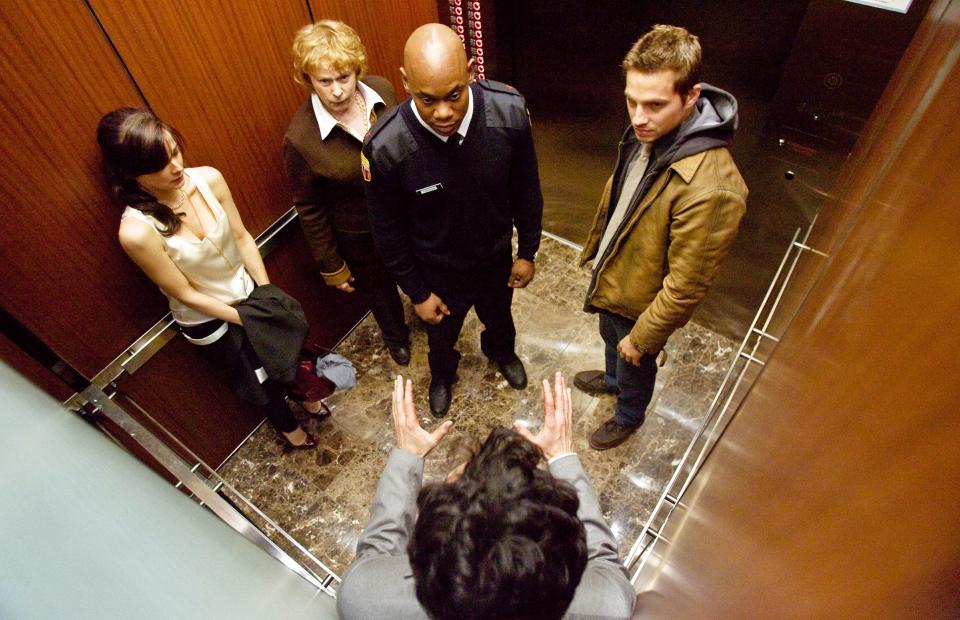 Five strangers begin to turn on one another as tensions rise in their stranded elevator in "Devil"