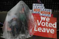 FILE - In this Tuesday, March 12, 2019 file photo a Pro-Brexit leave the European Union supporter takes part in a protest outside the Houses of Parliament in London. It’s more than four years since Britain voted to leave the European Union, and almost a year since Prime Minister Boris Johnson won an election by vowing to “get Brexit done.” Spoiler alert: It is not done. As negotiators from the two sides hunker down for their final weeks of talks on an elusive trade agreement, Britain and the EU still don’t know whether they will begin 2021 with an organized partnership or a messy rivalry.(AP Photo/Frank Augstein, File)