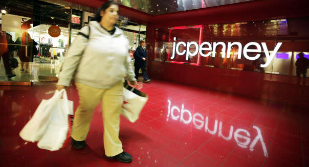 A customer leaves a J.C. Penney store, Tuesday, April 9, 2013 in New York. J.C. Penney is hoping its former CEO can revive the retailer after a risky turnaround strategy backfired and led to massive losses and steep sales declines. The company's board of directors ousted CEO Ron Johnson after only 17 months on the job. The department store chain said that it has rehired Johnson's predecessor, Mike Ullman. (AP Photo/Mark Lennihan)