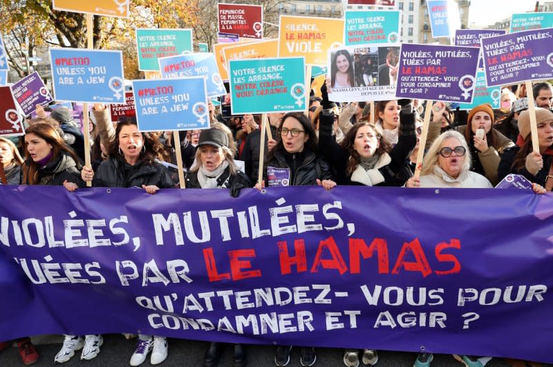 French Jewish women hijacked a feminist march in Paris to condemn their silence to the plea of female victims of Hamas during the 7 Oct terror attack in Israel, on Sunday, November 25, 2023. Many were clad in red-stained joggers, to echo 19-year-old Israeli hostage Naama Levy who was filmed with blood-soaked pants and her achilles tendon slashed during her abduction. Photo by Maya Vidon-White/UPI