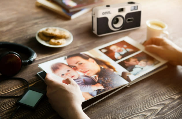 reusable camera next to a photobook