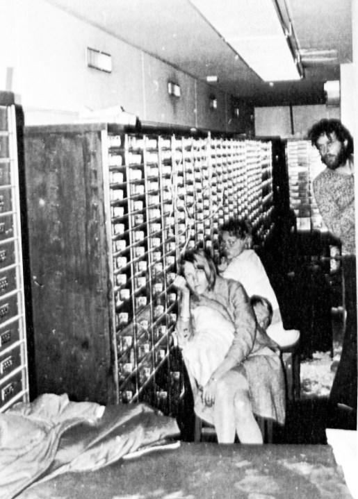 In this photo released by police, three of the four hostages and bank robber Clark Olofsson, standing right, are seen in a bank in Stockholm, Sweden, Aug. 27, 1973, shortly before the gunmen were overwhelmed by police. This week marks 50 years since a failed bank robbery that gave rise to the Stockholm syndrome, a term used in psychology to describe the bond that victims of kidnappings or hostage situations sometimes develop with their captors. (AP Photo, File)