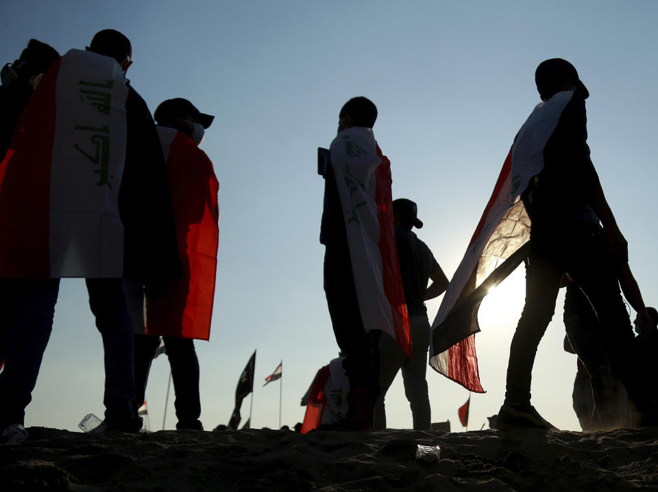 Anti-government protesters gather near the Tigris River during ongoing protests in Baghdad, Iraq, Friday, Nov. 1, 2019. (AP Photo/Hadi Mizban)