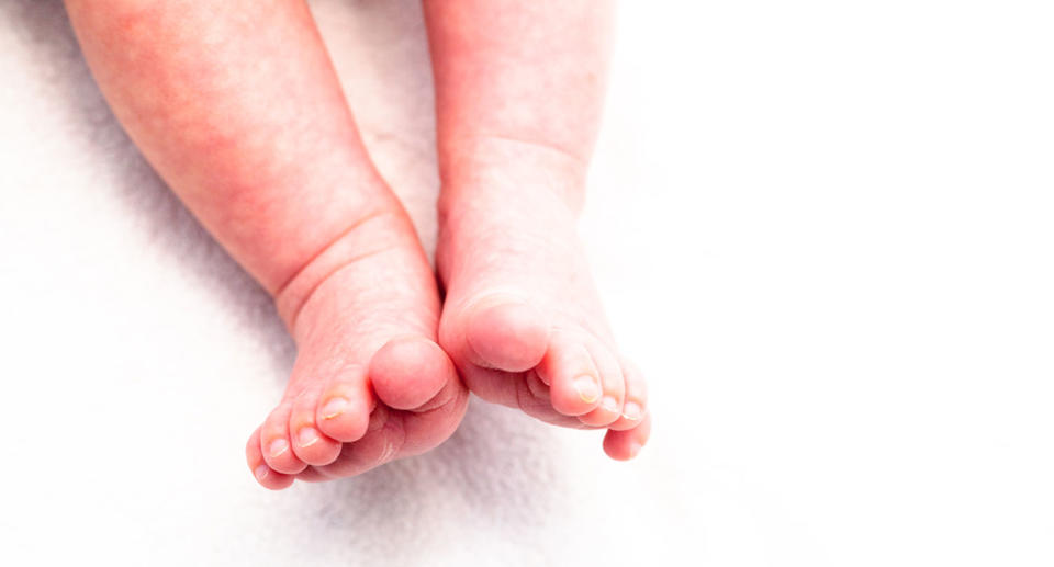 File photo of baby feet after mum charged with murder of infant who died 24 years ago in Kambalda, WA.