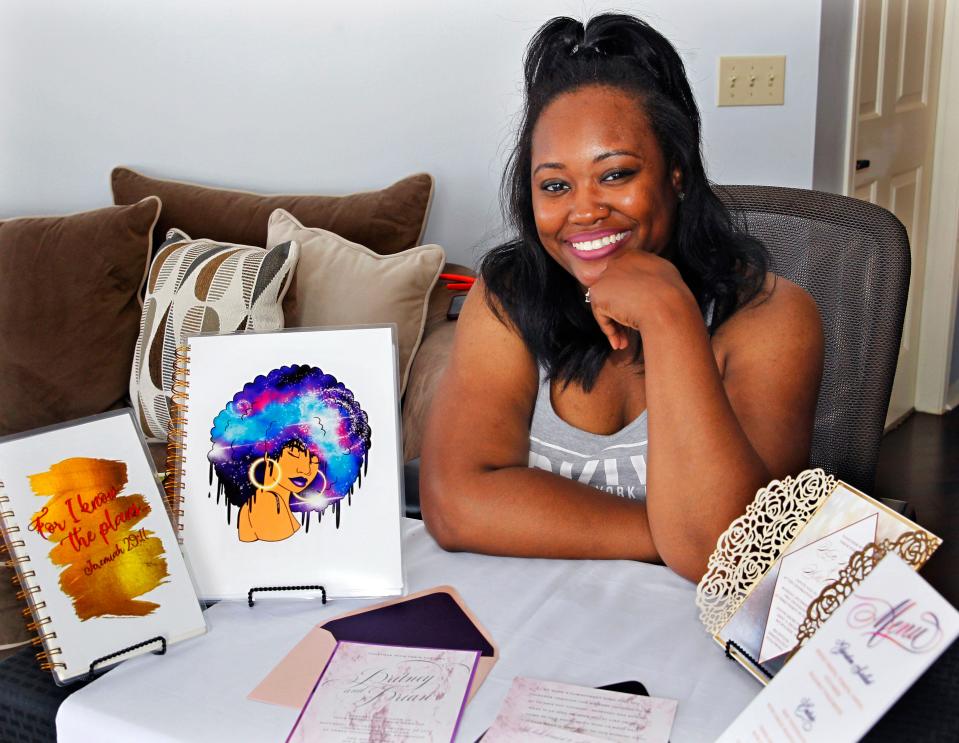 Star McMurty, owner of Taylor Designer & Stationary, displays some of her designs at her Franklin home.