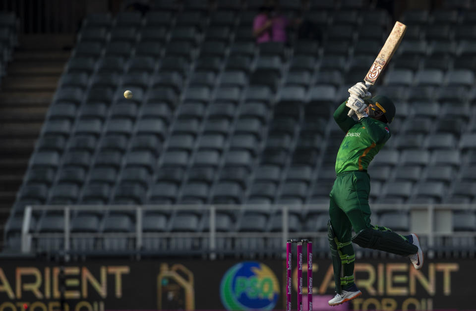 Pakistan's batsman Asif Ali plays a high ball from South Africa's bowler Kagiso Rabada delivery during the second One Day International cricket match between South Africa and Pakistan at the Wanderers stadium in Johannesburg, South Africa, Sunday, April 4, 2021. (AP Photo/Themba Hadebe)