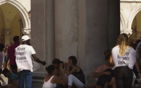 Tourists are moved on while sitting in St Mark's Square