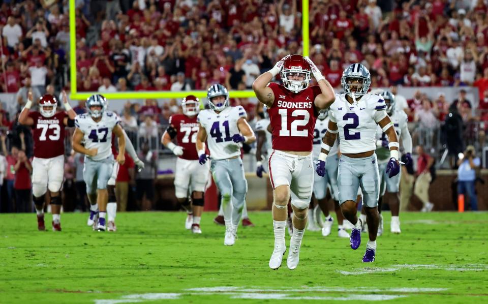 Oklahoma wide receiver Drake Stoops (12) reacts to being overthrown during the first half against Kansas State at Gaylord Family-Oklahoma Memorial Stadium.