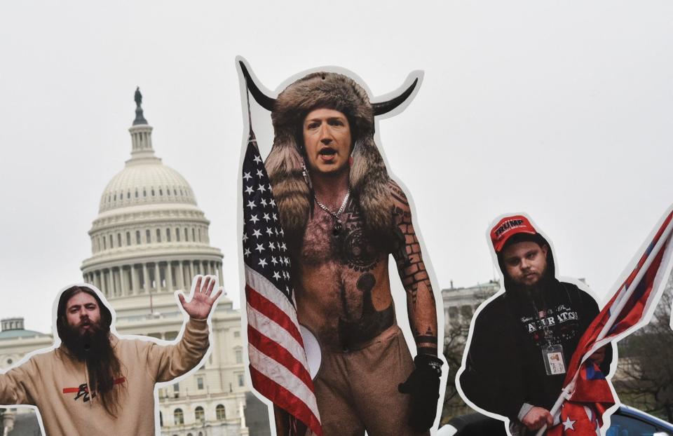 An effigy of Facebook CEO, Mark Zuckerberg (C), dressed as a Jan. 6 insurrectionist is placed near the Capitol in Washington, DC, on March 25.