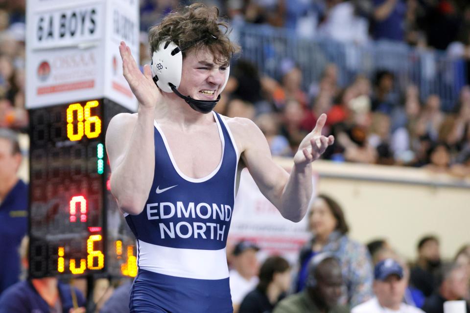 Jake Goodin of Edmond North celebrates after winning the Class 6A 106-pound championship match at the state tournament Saturday night at State Fair Arena.