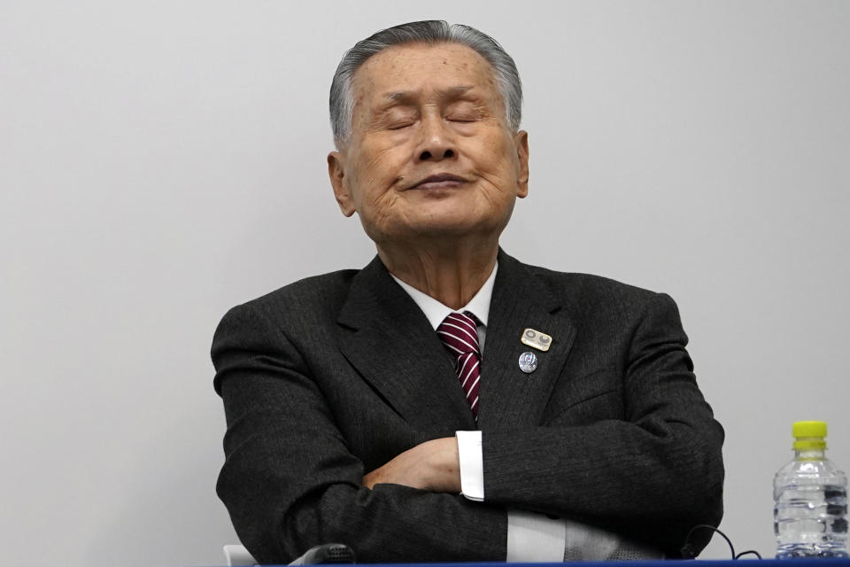 Tokyo 2020 Olympics chief Yoshiro Mori listens to questions from journalist during a press conference Monday, March 23, 2020, in Tokyo. As infections soared in Europe and the United States and the world economy spiraled downward, Japan on Monday hinted at the next possible victim of the globe-spanning coronavirus: The 2020 Tokyo Olympics. (AP Photo/Eugene Hoshiko)