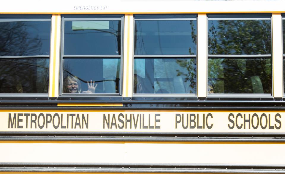 A child weeps on a bus leaving the Covenant School in Nashville after a mass shooting at the school Monday morning. Three students and three adults were killed before the shooter was killed by police on the scene.