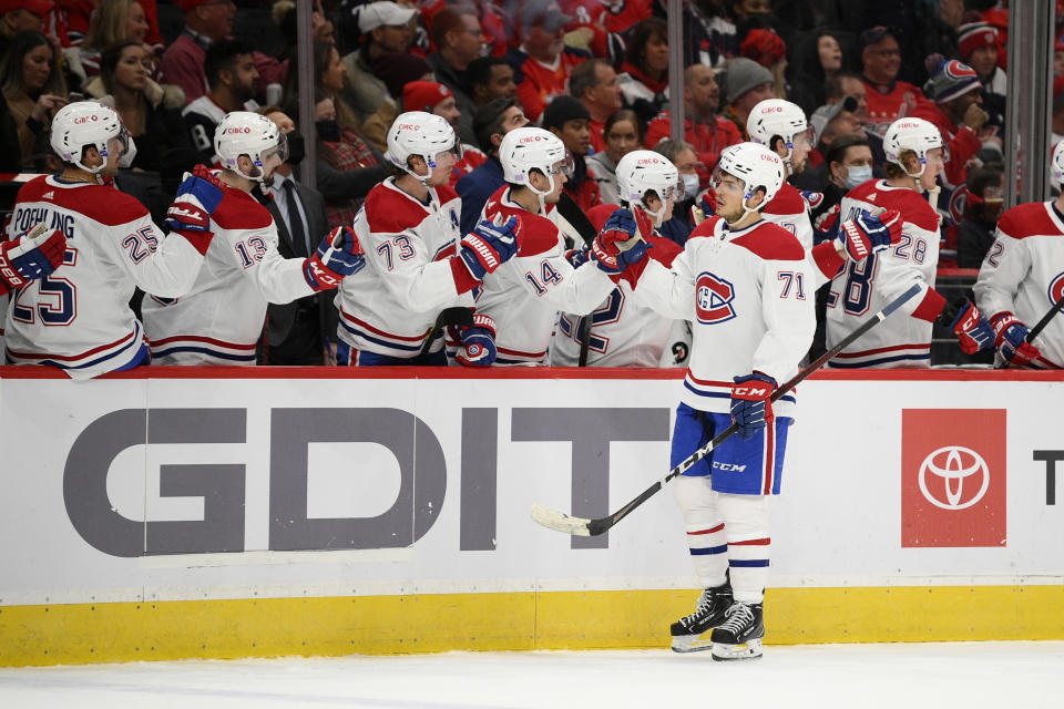 Montreal Canadiens center Jake Evans (71) is congratulated for his goal during the first period of the team's NHL hockey game against the Washington Capitals, Wednesday, Nov. 24, 2021, in Washington. (AP Photo/Nick Wass)