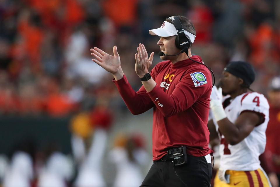 Southern California coach Lincoln Riley applauds during the first half of the team's NCAA college football game against Oregon State on Saturday, Sept. 24, 2022, in Corvallis, Ore. (AP Photo/Amanda Loman)