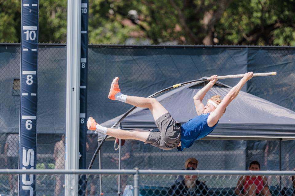 Bartlesville High pole vaulter Kade Bostwick soars over the bar during practice this week in preparation for the state meet.