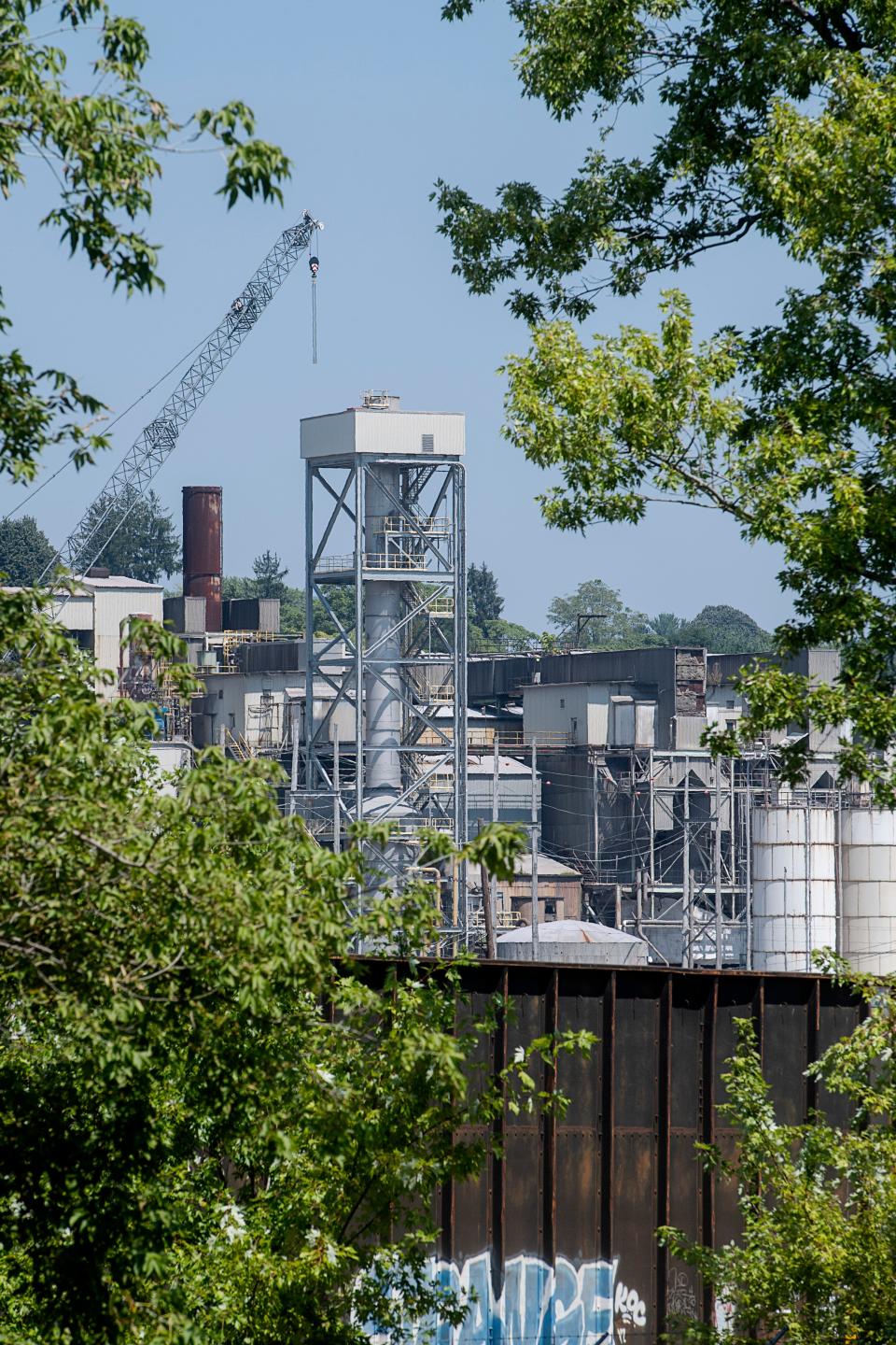 A crane arrived in Canton over the weekend to help disassemble the smokestacks of the mill.