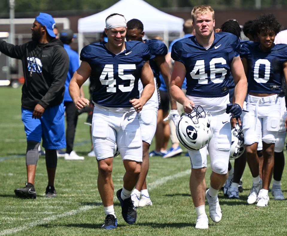 Siblings Michael Daley and John Henry Daley trot off the field after BYU’s football practice in Provo on Tuesday, Aug. 8, 2023. | Scott G Winterton, Deseret News