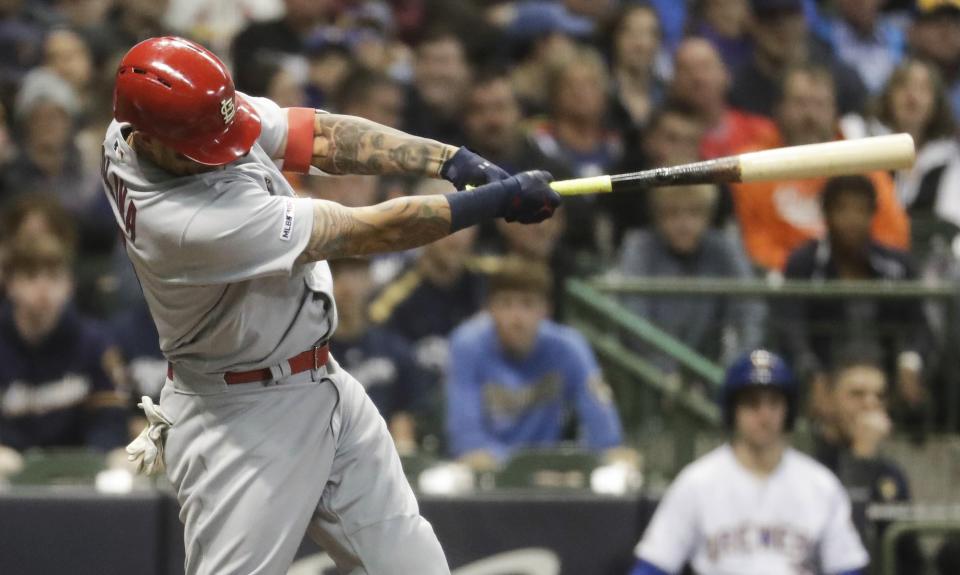 St. Louis Cardinals' Yadier Molina hits an RBI double during the first inning of a baseball game against the Milwaukee Brewers Friday, March 29, 2019, in Milwaukee. (AP Photo/Morry Gash)