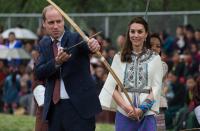 Kate did not look convinced when she watched Prince William prepare to fire an arrow at The Changlingmethang National Archery ground on tour in Thimphu in April 2016. (Roberto Schmidt/AFP)