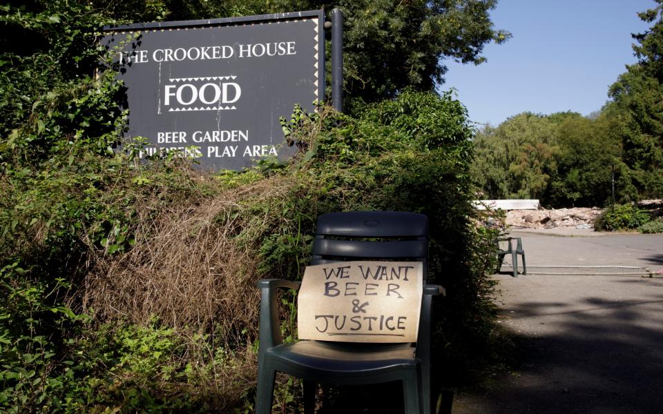 A protest sign left at the entrance to the pub