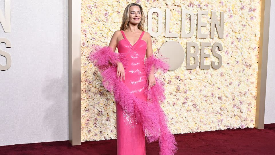 Margot Robbie and Armani came up with a dress inspired by a classic "Superstar Barbie" doll of 1977. - Gilbert Flores/Golden Globes/Getty Images