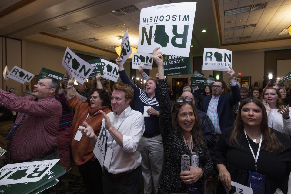 Supporters cheers as Sen. Ron Johnson, R-Wis., speaks to his supporters in the early morning hours at an election night party in Neenah, Wis., Wednesday, Nov. 9, 2022. (AP Photo/Mike Roemer)