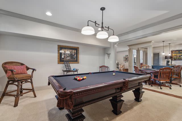 <p>George Stewart Impact Photo</p> The pool table in the two-tier basement