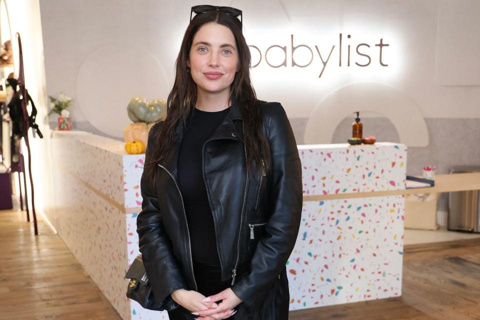 <p>Rodin Eckenroth/Getty </p> Pregnant Ashley Benson smiles as she visits Babylist Beverly Hills showroom