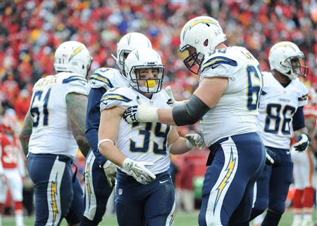 Nov 24, 2013; Kansas City, MO, USA; San Diego Chargers running back Danny Woodhead (39) is congratulated by guard Jeromey Clary (66) after scoring a touchdown during the second half of the game against the Kansas City Chiefs at Arrowhead Stadium. The Chargers won 41-38. Mandatory Credit: Denny Medley-USA TODAY Sports