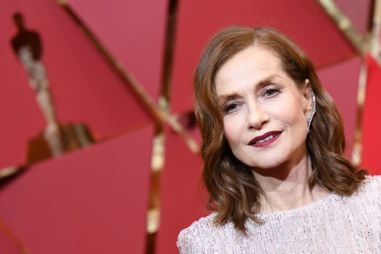 Nominee for best actress in "Elle", Isabelle Huppert oozed glamour in her glittering long-sleeved, champagne floor-length Armani gown with a demure neckline