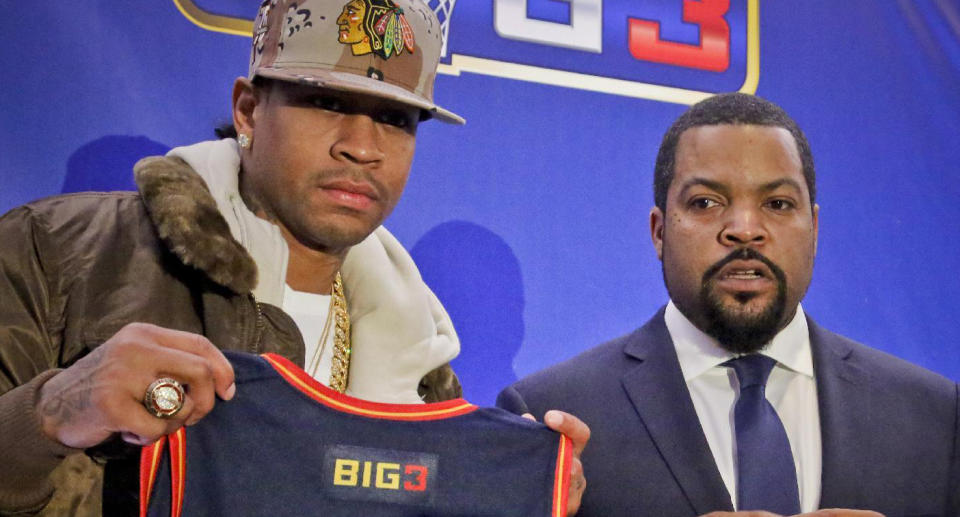 Former NBA player Allen Iverson, left, shows his jersey as he poses with entertainer Ice Cube after they announced the launch of the BIG3, a new 3-on-3 professional basketball league, in New York, Wednesday, Jan. 11, 2017. (AP Photo/Bebeto Matthews)