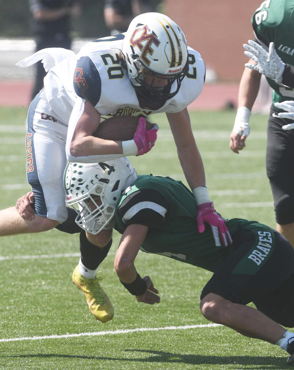 Oakfield-Alabama/Elba's Avery Watterson gets brought down by Avon's Christopher Thompson.