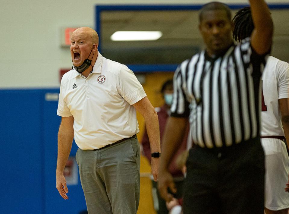 Ballard assistant coach Greg Willis yelled to his players during the boys LIT semifinal Friday night at Valley High School. Male defeated Ballard 65-59, advancing to the LIT final on Saturday night. January 14, 2022