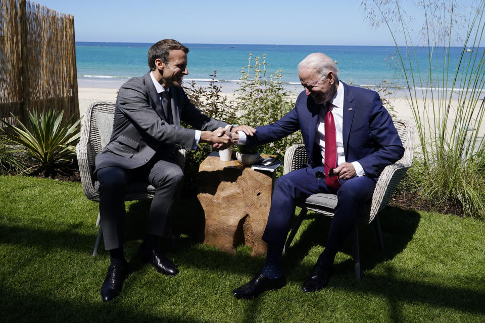 President Joe Biden and French President Emmanuel Macron visit during a bilateral meeting at the G-7 summit, Saturday, June 12, 2021, in Carbis Bay, England. (AP Photo/Patrick Semansky)