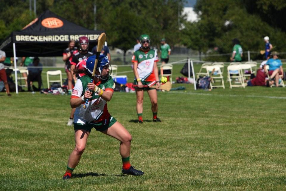 A player uses his hurley to strike the ball during a recent game with the Cleveland St. Pat's hurling team.