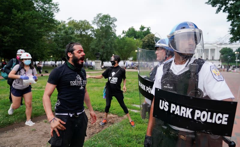 Police clash with protestors attempting to pull down statue of U.S. President Andrew Jackson in front of the White House in Washington