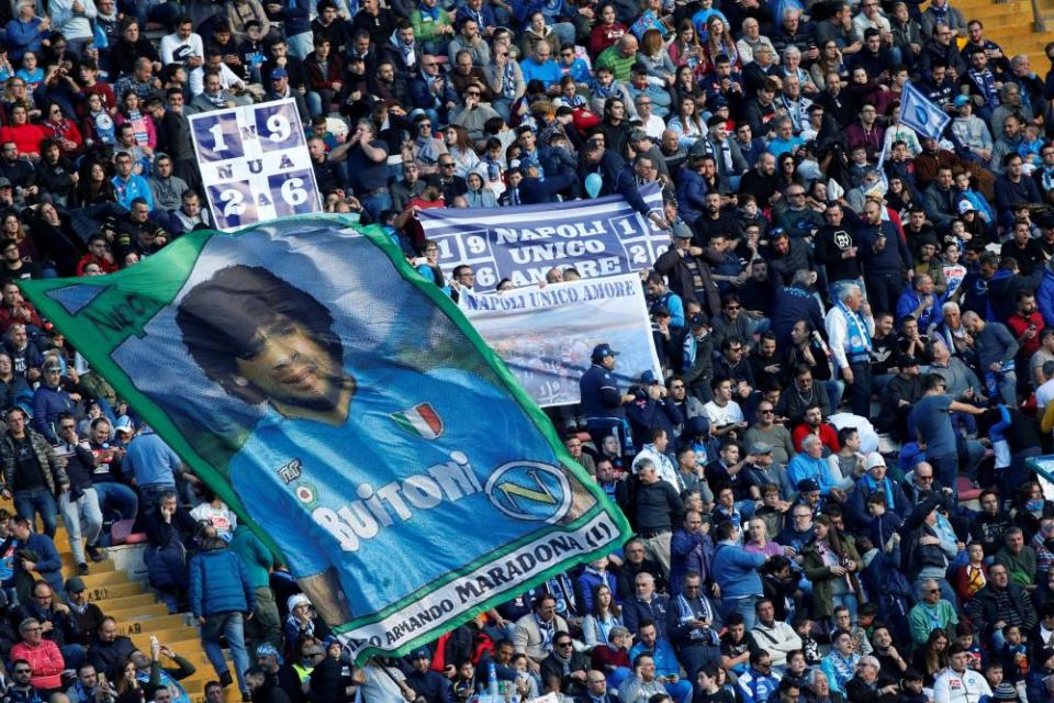 Napoli fans display a banner for their former player Diego Maradona before a match at San Paolo stadium in 2017.