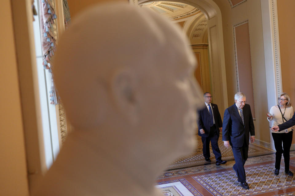 Senate Majority Leader Mitch McConnell (R-KY) speaks to reporters while walking to his office, as Mayor Muriel Bowser declared a state of emergency due to the coronavirus disease (COVID-19), on Capitol Hill in Washington