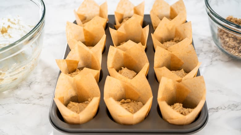 Muffin batter in parchment paper liners